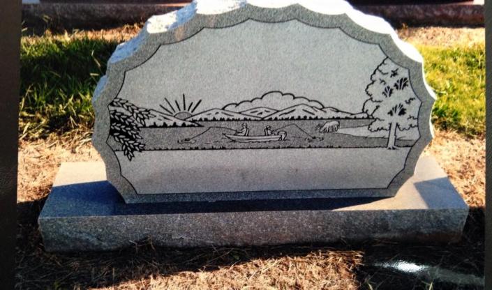 A sketched monument with a one of kind scene offers a more personalized option for a grave marker. 